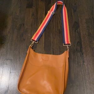 Ahdorned leather bag-strap included